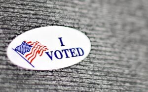 I voted sticker on the sweater of a Kincaid for Senate campaign volunteer.